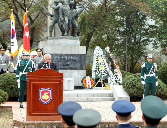 Turkish Ambassador to Korea Arslan Hakan Okcal (behind podium) speaks at a ceremony next to the Turkish Monument in Yongin, Gyeonggi Province, Tuesday, to commemorate the 66th anniversary of the Turkish Brigade’s participation in the Korean War. (Turkish Embassy)