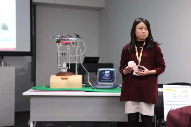 A researcher demonstrates an ultrasonic machine that can be controlloed on a tablet PC on Nov. 11 at Waseda University, Tokyo. (Park Ga-young/The Korea Herald)