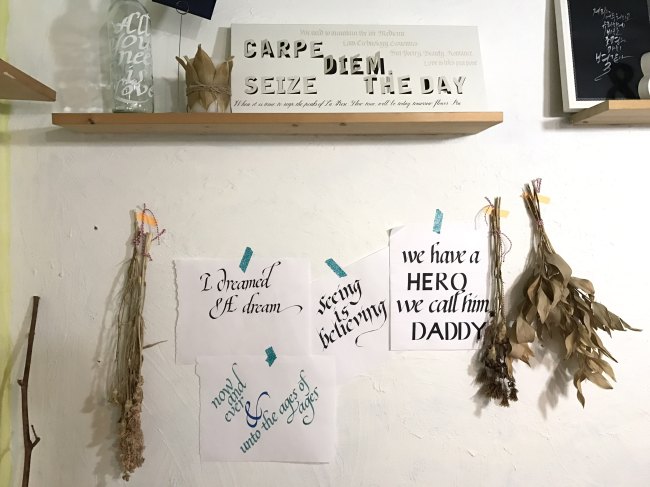 Drafts of calligraphy hang on the wall at artists Jang Yong-a and Jeon Hyun-young’s studio in Seoul’s Hongik University area. (Lim Jeong-yeo / The Korea Herald)