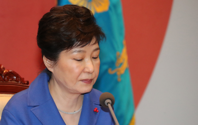 President Park Guen-hye holds an emergency Cabinet meeting at the presidential office Cheong Wa Dae in Seoul after the National Assembly voted to impeach her on Friday. (Yonhap)