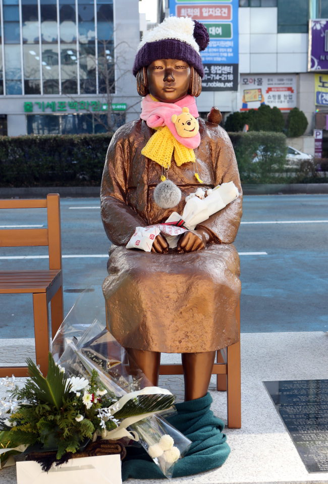 `Comfort women` statue installed at the end of last year by a civic group in front the Japanese Consulate General building in in Busan (Yonhap)