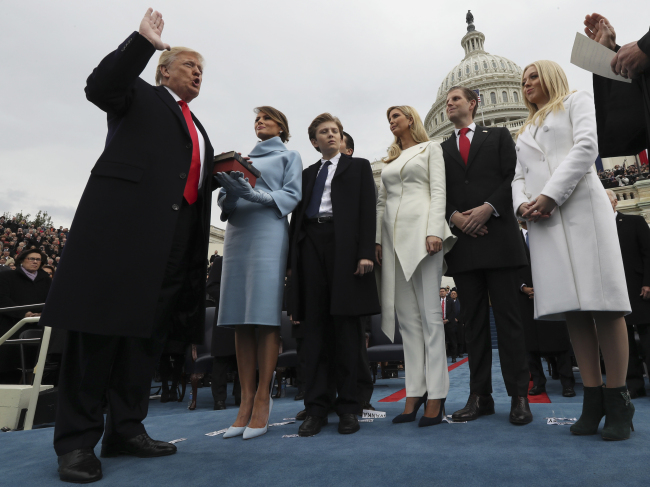 President Donald Trump takes the oath of office from Chief Justice John Roberts, as his wife Melania holds the bible, and with his children Barron, Ivanka, Eric and Tiffany, Jan. 27 on Capitol Hill in Washington. (Jim Bourg/Pool Photo via AP)
