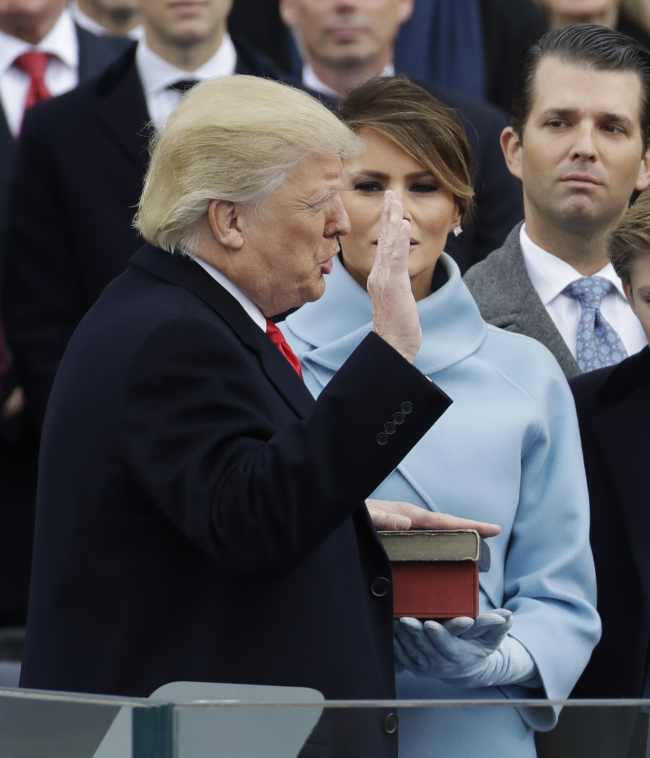 Donald Trump is sworn in as the 45th president of the United States by Chief Justice John Roberts as Melania Trump looks on during the 58th Presidential Inauguration at the U.S. Capitol in Washington, Jan. 20, 2017. (AP)
