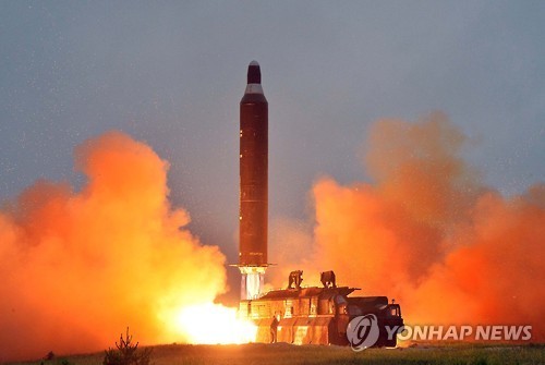 This undated file photo shows a ballistic missile about to be launched from a mobile launcher in North Korea. (Yonhap)