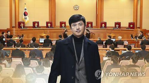 This image taken from Yonhap News TV shows Ko Young-tae against the background of the main courtroom of the Constitutional Court in Seoul. (Yonhap)