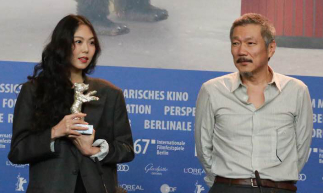 Kim Min-hee poses with the trophy for the best actress award at the 67th Berlin International Film Festival in Berlin. (Yonhap)