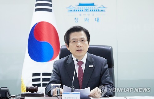 Acting President and Prime Minister Hwang Kyo-ahn presides over a meeting of the Standing Committee of the National Security Council at the presidential office in this photo released by the presidential office on March 6, 2017. (Yonhap)