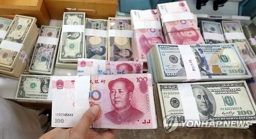 Stacks of foreign currency notes. (Yonhap)
