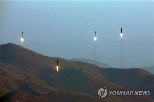 This photo, released by North Korea's Rodong Sinmun daily on March 7, 2017, shows four ballistic missiles being fired during a drill from an area near Tongchang-ri in northwest North Korea. (For Use Only in the Republic of Korea. No Redistribution) (Yonhap)