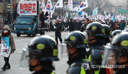 Supporters of ousted President Park Geun-hye march in Seoul on March 11, 2017, during a rally in protest of the Constitutional Court's decision to remove her from office the previous day. (Yonhap)