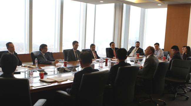An exchange-traded fund management team at Mirae Asset Global investments discusses global ETF market trends at the company’s head office in central Seoul. (Mirae Asset Global investments)