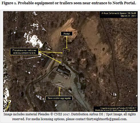 A satellite image showing four or five vehicles or trailers at the entrance to the North Portal of North Korea's Punggye-ri nuclear test site unveiled by 38 North. (Yonhap)