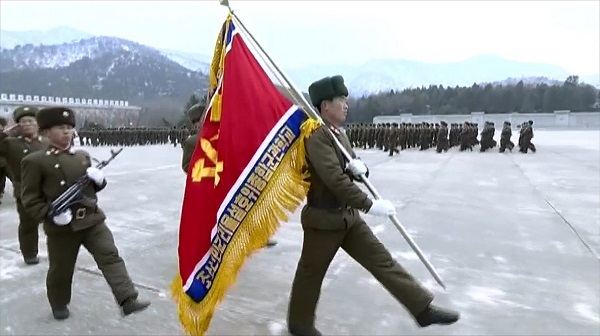 In this image captured from video footage of North Korea's Korean Central TV on April 3, 2017, a soldier holds a flag of the Ri Ul-sol Guard General Service Military Academy. (For Use Only in the Republic of Korea. No Redistribution) (Yonhap)