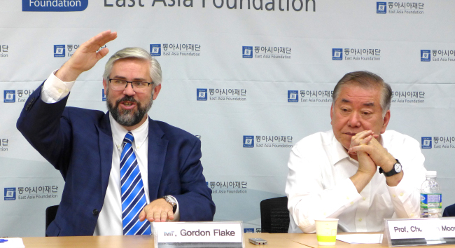 Gordon Flake (left), professor and chief executive officer of The University of Western Australia’s Perth USAsia Center, speaks beside Moon Chung-in, distinguished professor emeritus at Yonsei University Songdo Campus, at a seminar at East Asia Foundation on Apr. 11. (Joel Lee/The Korea Herald)