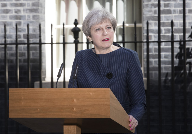 British Prime Minister Theresa May speaks to media as she calls a snap general election in London on Tuesday. (Xinhua-Yonhap)