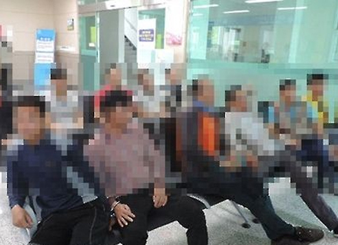 This file photo shows foreign nationals in the country illegally at a police station on South Korea's Jeju Island. (Yonhap)