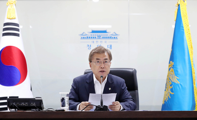 President Moon Jae-in presides over a plenary meeting of the National Security Council at Cheong Wa Dae Thursday after North Korea fired missiles. (Yonhap)