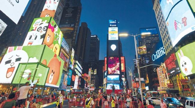 Billboard ads featuring Line Friends characters are displayed at Times Square in New York City. Line Firends plans to open its first US store in the area in August. (Line Friends)