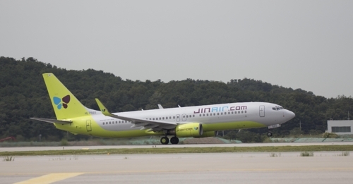 A Jin Air B737-800 passenger jet takes off from a runway in this undated photo. (Photo courtesy of Jin Air)