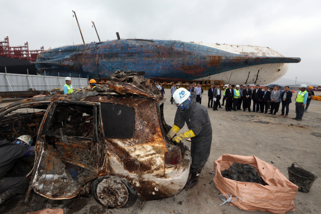 A worn-out car which has been inside Sewol's wreckage for the past three years is seen at Mokpo port, Jeolla Province. (Yonhap)