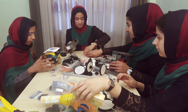 In this Thursday, July 6, 2017 photo, teenagers from the Afghanistan Robotic House, a private training institute, practice at the Better Idea Organization center, in Herat, Afghanistan. Six female students from war-torn Afghanistan who had hoped to participate in an international robotics competition July 16-18 in Washington D.C will have to watch via video link after the U.S. denied them visas -- not once, but twice. Of 162 teams participating, the Afghan girls are the only nation’s team to be denied visas. (Yonhap-AP)