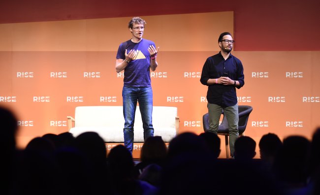 Paddy Cosgrave (left), co-founder and CEO of RISE & Web Summit, and Casey Lau, founder of StartupsHK, speak at the opening session of RISE 2017 held at Hong Kong Convention & Exhibition Center on Tuesday. (RISE)