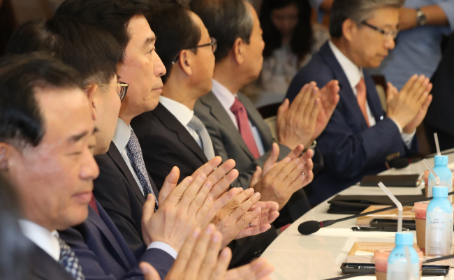 Business representatives attend at a meeting held by Korea Chamber of Commerce and Industry on Tuesday in Seoul. (Yonhap)