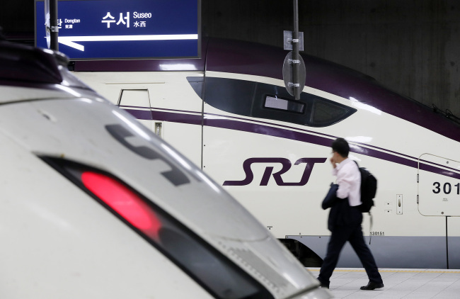 A passenger walks past a train at Suseo Station. (Yonhap)