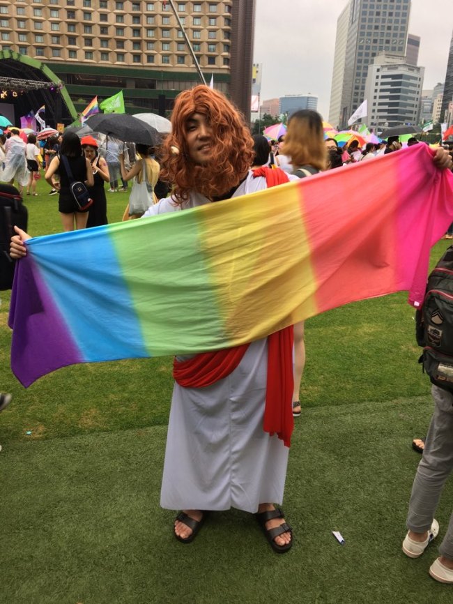 Chung Sang-hyuk, a 26-year-old Protestant who dressed as Jesus, poses for a photo at Seoul Plaza ahead of the pride parade in central Seoul on Saturday. (Ock Hyun-ju/The Korea Herald)