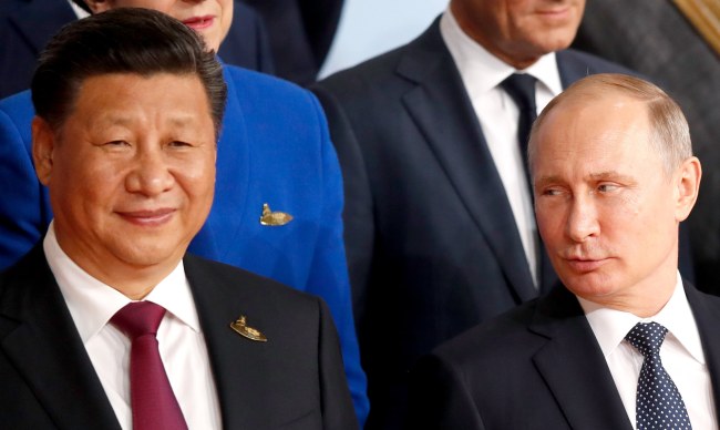 Russian President Vladimir Putin (right) and Chinese President Xi Jinping pose at the opening day of the G20 summit in Hamburg, Germany, 07 July 2017. The G20 Summit is an international forum for governments from 20 major economies. (EPA/FRIEDEMANN VOGEL)