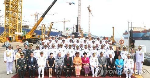 In this photo provided by Daewoo Shipbuilding & Marine Engineering Co., participants at a delivery ceremony of a submarine pose for a photo at its shipyard on Geoje Island, off the country`s southern coast on Aug. 2, 2017. The shipbuilder handed over the submarine to Indonesia, becoming the first South Korean company to export a submarine. (Yonhap)