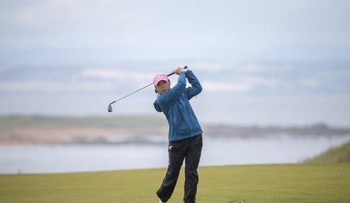 In this Associated Press photo, Kim In-kyung of South Korea watches her shot at the fourth hole during the third round of the Ricoh Women`s British Open at Kingsbarns Golf Links in Fife, Scotland, on Aug. 5, 2017. (Yonhap)
