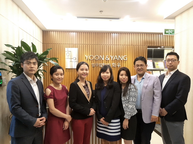 Zunu Lee (second from right), head of Yoon & Yang’s Vietnamese office, and its staff members pose at the firm’s Ho Chi Minh City office.