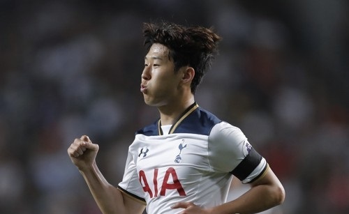 In this photo taken by the Associated Press on May 26, 2017, Tottenham Hotspur's South Korean attacker Son Heung-min celebrates after scoring a goal during a friendly match against Kitchee Sports Club in Hong Kong. (Yonhap)