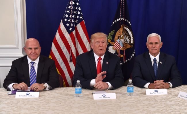 US President Donald Trump (center) speaks to reporters after a security briefing with National Security Adviser H.R. McMaster (left) and Vice President Mike Pence at Trump`s golf estate in Bedminster, New Jersey, Thursday. (AFP-Yonhap)