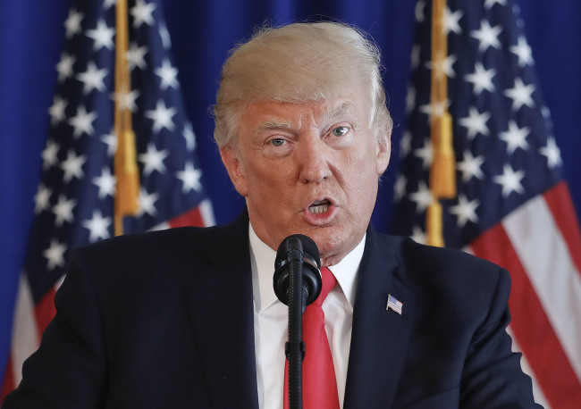 US President Donald Trump speaks regarding the ongoing situation in Charlottesville, Virginia, Saturday, at his private golf club in New Jersey. (AP-Yonhap)