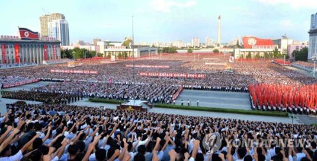 North Koreans stage a mass rally in Pyongyang on Aug. 9, 2017, to denounce the UN Security Council resolution imposing fresh sanctions on North Korea for its latest ICBM test. (Yonhap-KCNA)