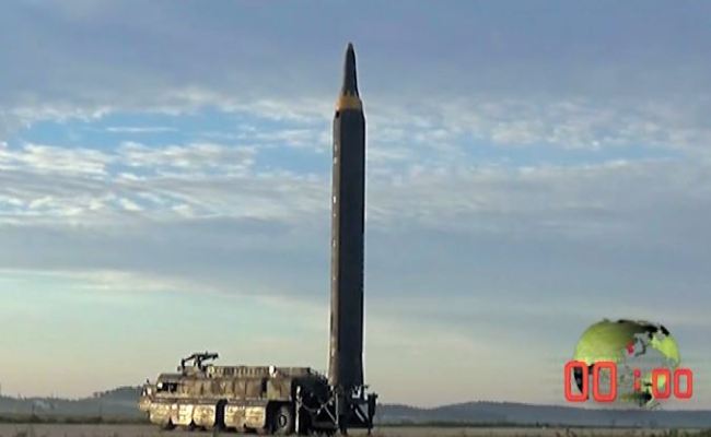 A North Korean intermediate-range ballistic missile is seen ready to take off in an image captured from video footage released by North Korea’s state media on Saturday. The missile was launched in the early hours of Friday.(Yonhap)