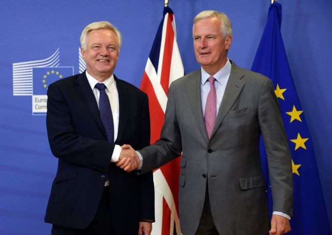 British Secretary of State for Exiting the European Union (Brexit Minister) David Davis (left) shakes hands with European Union Chief Negotiator in charge of Brexit negotiations with Britain Michel Barnier prior to their meeting at the European Union Commission headquarter in Brussels, July 17, 2017. (AFP PHOTO / THIERRY CHARLIER)