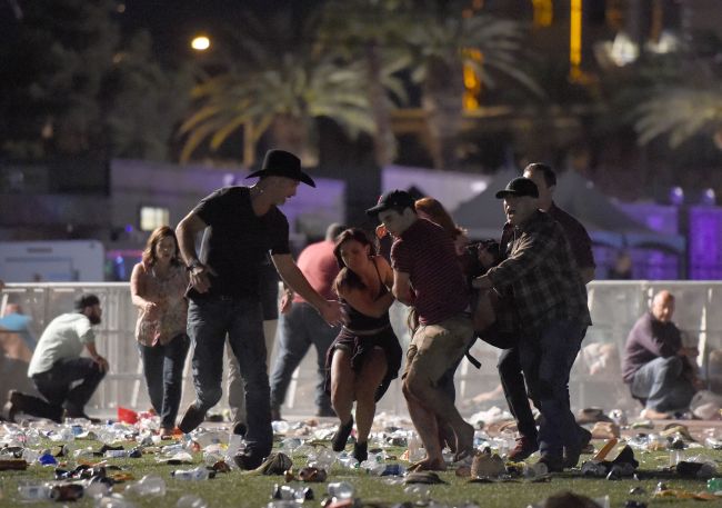 People carry a peson at the Route 91 Harvest country music festival after apparent gun fire was heard on Sunday in Las Vegas, Nevada. (AFP-Yonhap