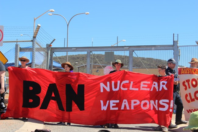 A handout photo made available by the International Campaign to Abolish Nuclear Weapons shows ICAN activists protesting against at a US military base near Alice Springs, Central Australia, Sept. 29. (EPA-Yonhap)