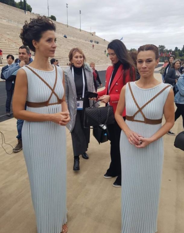 Artemis Ignatiou (R), the Greek choreographer of the lighting and handover ceremony of the Olympic flame for PyeongChang 2018, and Greek actress Katerina Lehou, who dressed as high priestess, speak to reporters after the Olympic flame handover ceremony at the Panathenaic Stadium in Athens. (Yonhap)