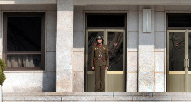 A North Korea soldier stands at Panmon Hall. Park Hyun-koo
