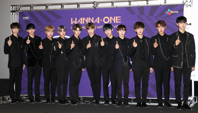 Wanna One poses during a press event for “1-1=0 (Nothing Without You),” a repackaged version of its debut EP “1X1=1 (To Be One)” in Seoul on Monday (Yonhap)