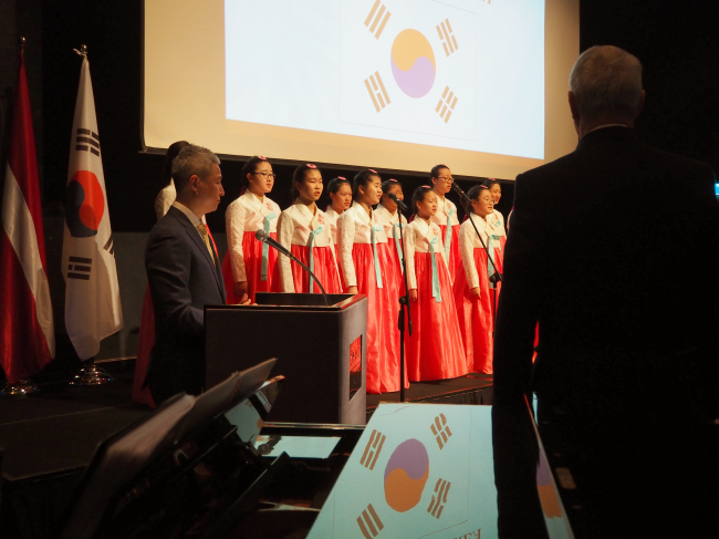 Incheon Seo-gu Girls and Boys Choir performs at the Latvian National Day reception on Friday. (Joel Lee/The Korea Herald)
