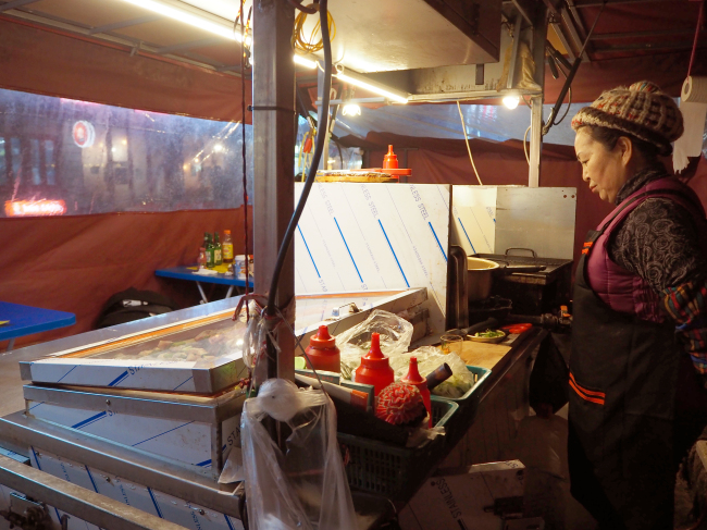 Gong Bo-bae, 62, the owner, has been running her pojangmacha for 20 years, since her family’s fortune started waning in the wake of the Asian financial crisis of 1997. (Joel Lee/The Korea Herald)