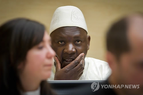 Former Congolese rebel commander Thomas Lubanga (Center), sits in a court room the International Criminal Court in the Hague, the Netherlands, 14 March 2012. (Yonhap)