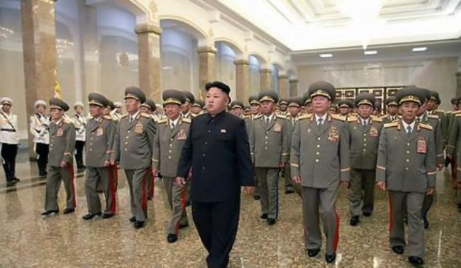 Kim Jong-un visiting the family mausoleum Kumsusan Palace in 2014. (Yonhap)