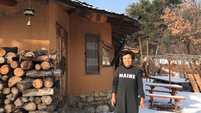 Airbnb host Yoon In-sook at her clay house 
