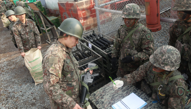 South Korean soldiers received firearms for logistics training at the Army’s 31 Infantry division on Thursday. Yonhap